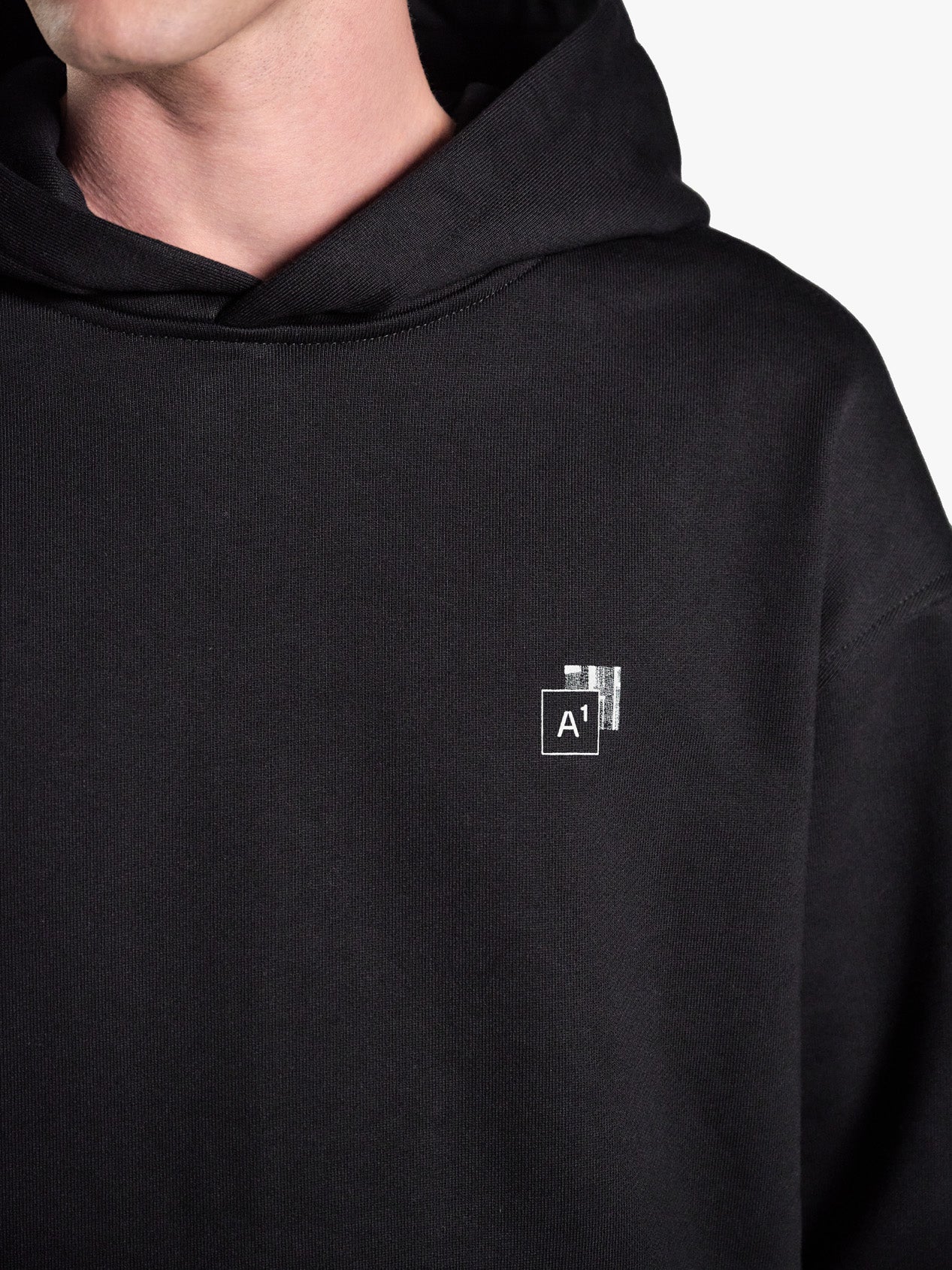 TRAPEZOID HOODIE "MONUMENT" BLACK